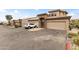 Charming townhome with two-car garage, stone accents, and desert landscaping providing a welcoming entrance at 13700 N Fountain Hills Blvd # 365, Fountain Hills, AZ 85268