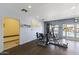 Community gym highlighting weight-lifting machine, a mirror and pool access with 'Exit' sign at 13700 N Fountain Hills Blvd # 365, Fountain Hills, AZ 85268