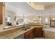Modern kitchen offers granite countertops, stainless steel appliances, a double sink and stylish wood cabinets at 13700 N Fountain Hills Blvd # 365, Fountain Hills, AZ 85268