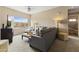 Comfortable living room with a plush gray couch, ottoman, and large view window at 13700 N Fountain Hills Blvd # 365, Fountain Hills, AZ 85268