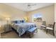 Bright main bedroom with large bed, view window, and stylish blue accents at 13700 N Fountain Hills Blvd # 365, Fountain Hills, AZ 85268