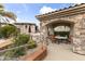 Outdoor kitchen and dining area with a grill, seating, and covered space for entertainment at 13700 N Fountain Hills Blvd # 365, Fountain Hills, AZ 85268