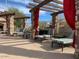 Relaxing poolside lounge area featuring stone pillars, wooden beams, and fabric drapes at 13700 N Fountain Hills Blvd # 365, Fountain Hills, AZ 85268