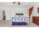 Comfortable bedroom features plush bedding, natural lighting, and neutral color scheme at 14363 W Acapulco Ln, Surprise, AZ 85379