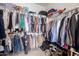Walk-in closet with ample storage and well-organized shelving for clothing, shoes and accessories at 14363 W Acapulco Ln, Surprise, AZ 85379