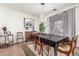 Elegant dining room featuring a dark wood table, seating for six, and decorative art at 14363 W Acapulco Ln, Surprise, AZ 85379