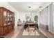 Spacious dining area with a large wooden hutch and decorative accents at 14363 W Acapulco Ln, Surprise, AZ 85379