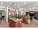 Well-appointed kitchen with stainless steel appliances, center island, and open layout at 14363 W Acapulco Ln, Surprise, AZ 85379