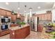 Spacious kitchen showcasing ample cabinetry, stainless steel appliances, and a central island at 14363 W Acapulco Ln, Surprise, AZ 85379
