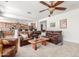 Open concept living space with a large sectional sofa and an adjacent kitchen area at 14363 W Acapulco Ln, Surprise, AZ 85379