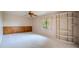 Bright bedroom with neutral carpet, natural light, ceiling fan and wood paneled accent wall at 14625 N 25Th Pl, Phoenix, AZ 85032