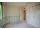This cozy bedroom has a decorative border, carpeted floor, and spacious closets, offering comfort and ample storage at 14625 N 25Th Pl, Phoenix, AZ 85032