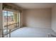 Comfortable living room featuring neutral carpet, a large window, and bright natural light at 14625 N 25Th Pl, Phoenix, AZ 85032