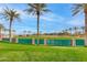 Baseball field protected by a green fence and several palm trees on the edge of the field at 15046 W Cooperstown Way, Surprise, AZ 85374