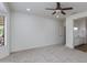 Spacious bedroom with neutral carpet and an adjacent bathroom with dual sinks at 15046 W Cooperstown Way, Surprise, AZ 85374