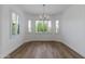 Dining area with large windows and plantation shutters at 15046 W Cooperstown Way, Surprise, AZ 85374