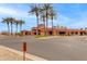 Beautiful exterior of the Palm Center featuring lush landscaping and a grand entrance, creating a welcoming atmosphere at 15046 W Cooperstown Way, Surprise, AZ 85374
