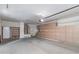 Spacious garage with wall-to-wall cabinets, epoxy flooring and water heater at 15046 W Cooperstown Way, Surprise, AZ 85374
