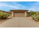 This property features a two-car garage with desert landscaping and neutral color palette at 15046 W Cooperstown Way, Surprise, AZ 85374