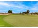 Well manicured golf course with rolling green hills and beautiful desert landscape in the background at 15046 W Cooperstown Way, Surprise, AZ 85374
