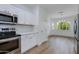 Updated kitchen with stainless steel appliances and eat in dining area at 15046 W Cooperstown Way, Surprise, AZ 85374