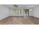 Open-concept living room boasts wood-look flooring and natural light, perfect for entertaining at 15046 W Cooperstown Way, Surprise, AZ 85374