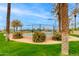 Community tennis courts surrounded by green grass and landscaping, offering a great recreational amenity at 15046 W Cooperstown Way, Surprise, AZ 85374