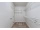 Spacious walk-in closet with carpeted floor and wire shelving for ample storage at 15046 W Cooperstown Way, Surprise, AZ 85374