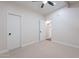 Bedroom with plush carpet, ceiling fan and ensuite bathroom at 15255 N 5Th Ln, Phoenix, AZ 85023