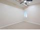This bedroom offers ample natural light, plush carpet, and a ceiling fan at 15255 N 5Th Ln, Phoenix, AZ 85023