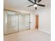 Bedroom with plush carpet, large mirror closet and ensuite bathroom at 15255 N 5Th Ln, Phoenix, AZ 85023