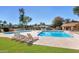 Resort-style pool area complete with lounge chairs and lush landscaping, perfect for relaxation and recreation at 15255 N 5Th Ln, Phoenix, AZ 85023