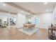Sunlit dining area with decorative brick, modern light fixture, and wood floors at 15255 N 5Th Ln, Phoenix, AZ 85023