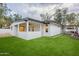 Exterior view of a home with a covered patio and lush artificial grass at 15255 N 5Th Ln, Phoenix, AZ 85023