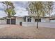 Charming single-story home with a two-car garage and low-maintenance desert landscaping in front at 15255 N 5Th Ln, Phoenix, AZ 85023