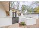 Charming home featuring a gated front courtyard, a unique white brick wall, and beautiful landscaping at 15255 N 5Th Ln, Phoenix, AZ 85023