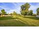 Expansive grassy common area featuring mature trees and verdant lawns providing a serene outdoor environment at 15255 N 5Th Ln, Phoenix, AZ 85023