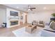 Spacious living room features a fireplace and modern, comfortable furnishings at 15255 N 5Th Ln, Phoenix, AZ 85023