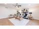 Bright living room with modern decor, a ceiling fan, and an area rug at 15255 N 5Th Ln, Phoenix, AZ 85023