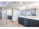 The main bathroom features dual sinks, elegant mirrors and vanities, and a glass shower at 15255 N 5Th Ln, Phoenix, AZ 85023