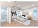 Spacious main bedroom with plush rug, ceiling fan, and ensuite bathroom at 15255 N 5Th Ln, Phoenix, AZ 85023