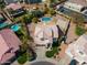 Aerial view of the home, pool, landscaping, basketball court and neighboring houses at 16428 N 39Th Pl, Phoenix, AZ 85032