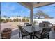 Backyard patio area with table, chairs, plants and a BBQ at 16428 N 39Th Pl, Phoenix, AZ 85032