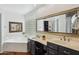 Bathroom featuring double sink vanity, soaking tub, and ample natural light at 16428 N 39Th Pl, Phoenix, AZ 85032