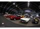 A selection of vintage cars showcased indoors, highlighting their classic designs and pristine condition at 16428 N 39Th Pl, Phoenix, AZ 85032