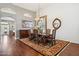 Formal dining room with a hardwood floor, elegant chandelier, and an ornate rug underneath the table at 16428 N 39Th Pl, Phoenix, AZ 85032