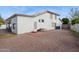 Rear exterior view of house, showing backyard access and architectural details at 16428 N 39Th Pl, Phoenix, AZ 85032