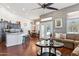 Open-concept living space with a modern kitchen, dining area, and comfortable seating arrangement at 16428 N 39Th Pl, Phoenix, AZ 85032