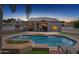 A private backyard featuring a refreshing pool with a brick surround and an outdoor dining space at 16428 N 39Th Pl, Phoenix, AZ 85032
