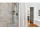 Tiled shower with built-in niche and seat, showcasing modern design and functionality at 16428 N 39Th Pl, Phoenix, AZ 85032